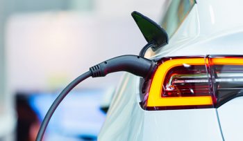 Electric vehicle bought with green car loan charging - QPF Finance Green Loans Specialists